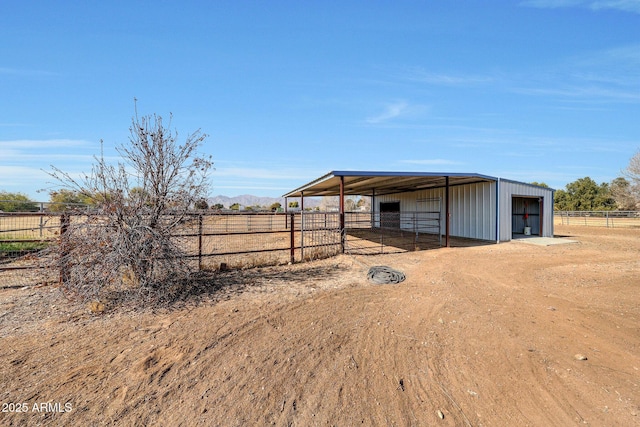 view of outbuilding with a rural view