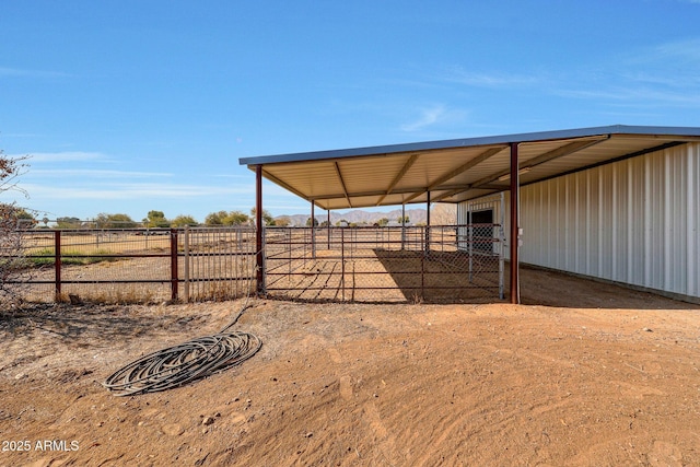 exterior space featuring an outbuilding and a rural view