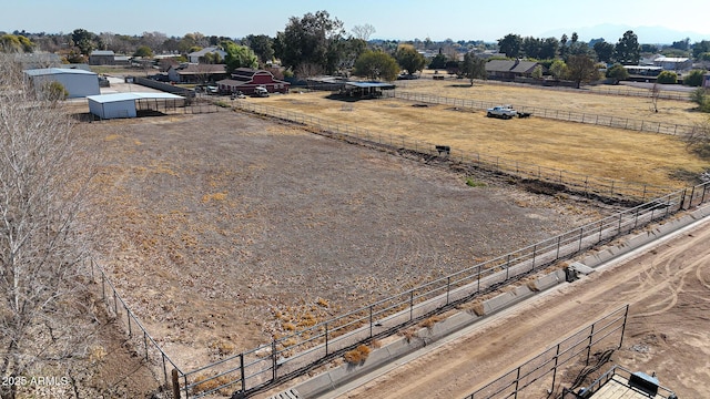 birds eye view of property featuring a rural view