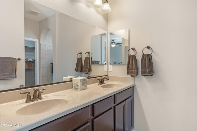 bathroom featuring ceiling fan and vanity