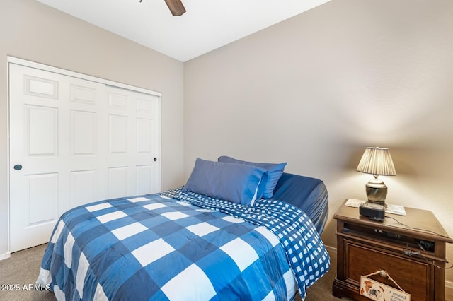 bedroom with ceiling fan, carpet floors, and a closet