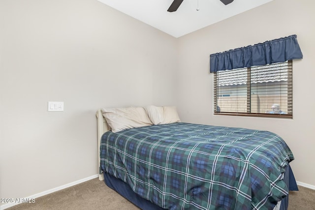 bedroom with ceiling fan and carpet floors