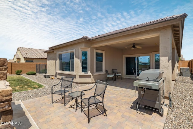 back of house featuring ceiling fan and a patio