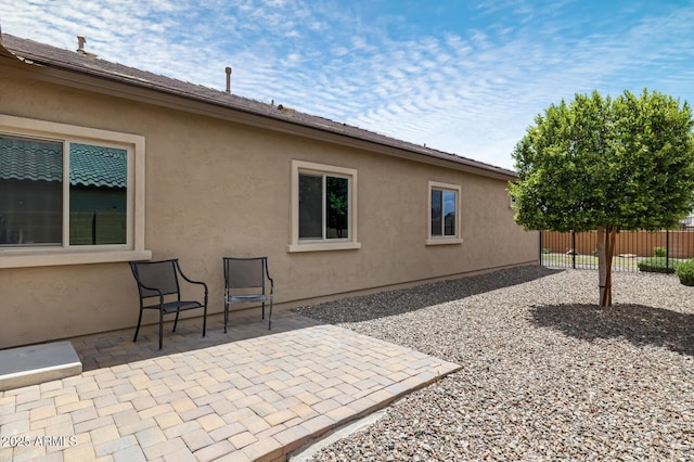 view of property exterior featuring a patio area