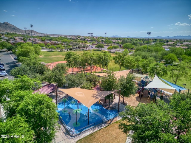 birds eye view of property with a mountain view