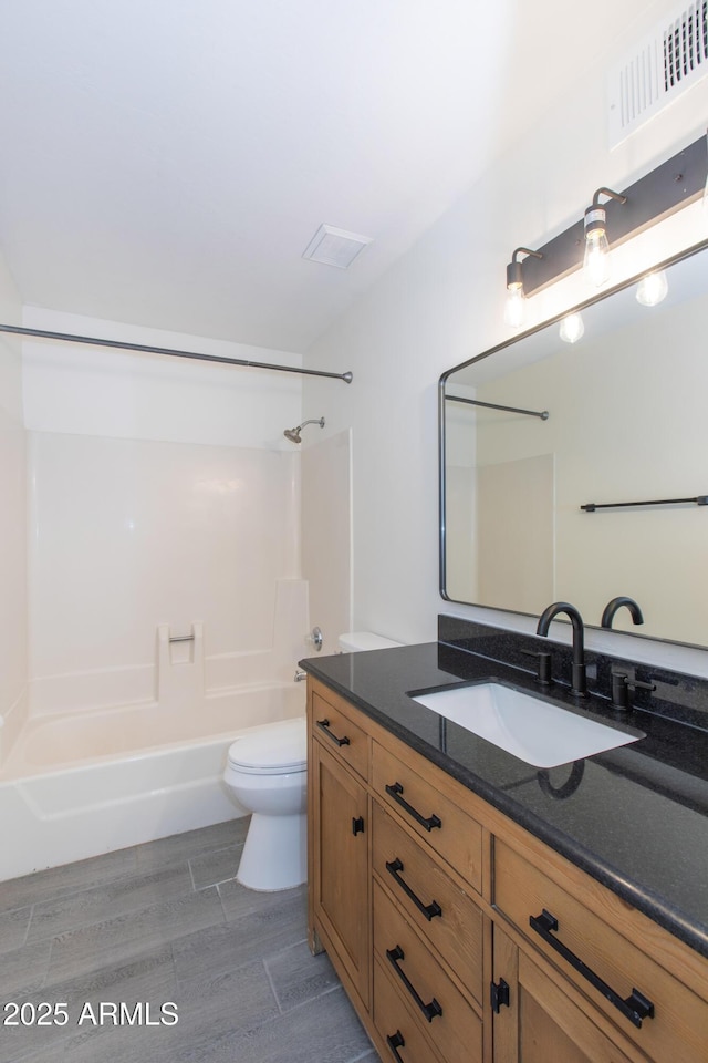 222 W Brown Rd Unit 72, Mesa, AZ 85201 - bathroom with bathtub / shower combination, vanity, toilet, and wood finished floors