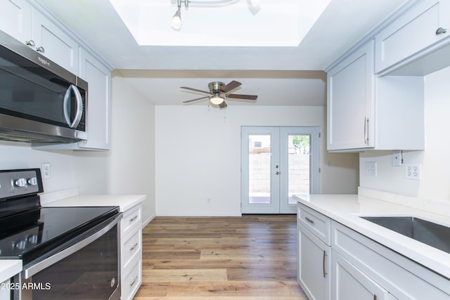 222 W Brown Rd Unit 72, Mesa, AZ 85201 - kitchen featuring stainless steel appliances, light countertops, french doors, and light wood-style flooring