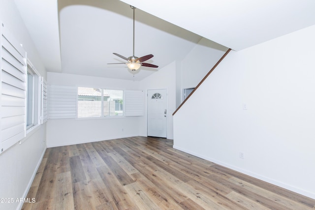 222 W Brown Rd Unit 72, Mesa, AZ 85201 - unfurnished living room featuring wood finished floors, a ceiling fan, baseboards, and high vaulted ceiling