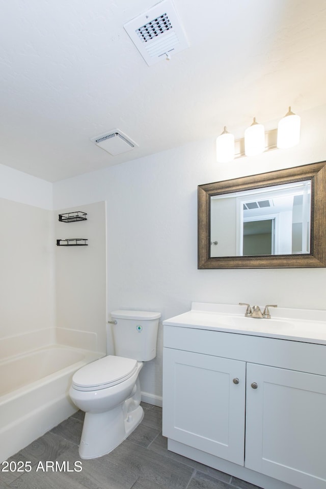 222 W Brown Rd Unit 72, Mesa, AZ 85201 - full bath featuring vanity, toilet, washtub / shower combination, and baseboards