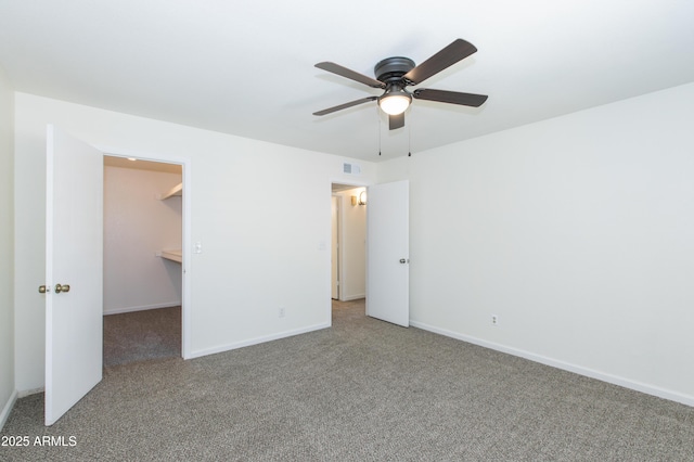 222 W Brown Rd Unit 72, Mesa, AZ 85201 - unfurnished bedroom with carpet floors, a spacious closet, and baseboards