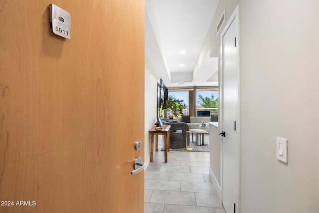 corridor with light tile patterned flooring