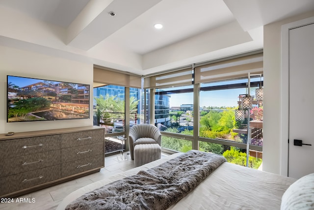 bedroom with light tile patterned flooring and multiple windows