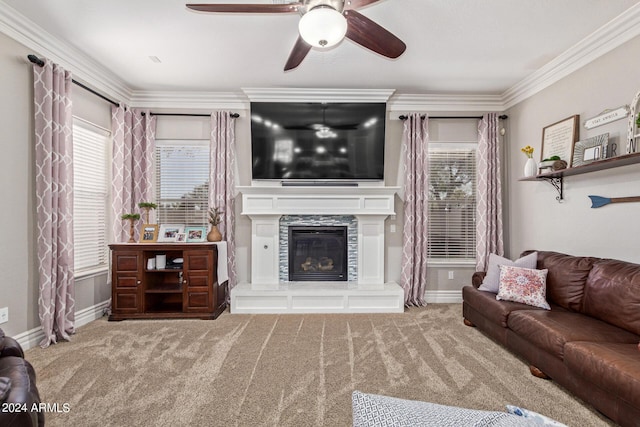 living room featuring crown molding, ceiling fan, and carpet