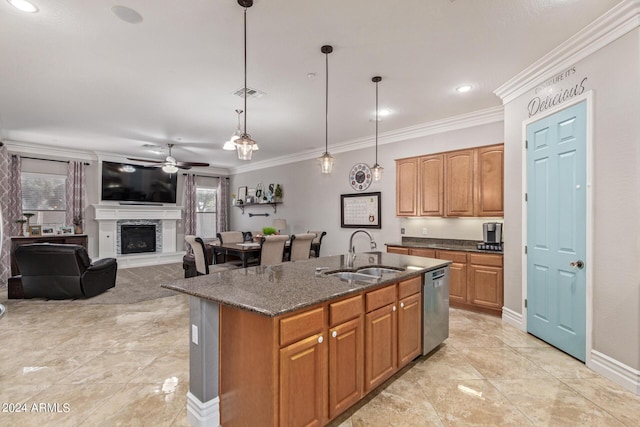 kitchen with sink, crown molding, stainless steel dishwasher, pendant lighting, and a kitchen island with sink