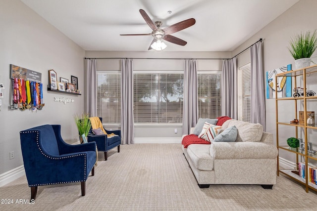 sitting room featuring carpet floors and ceiling fan