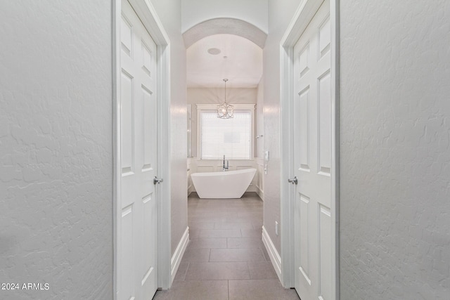 hallway featuring tile patterned floors