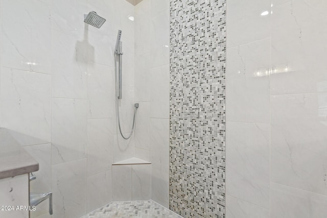 bathroom with tiled shower