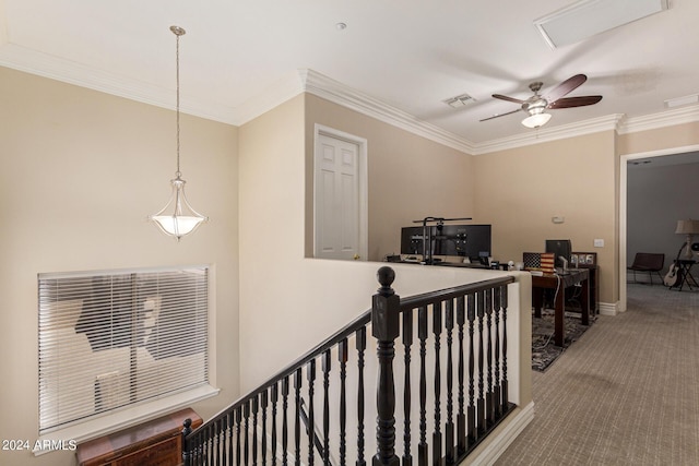 hallway with ornamental molding and carpet flooring