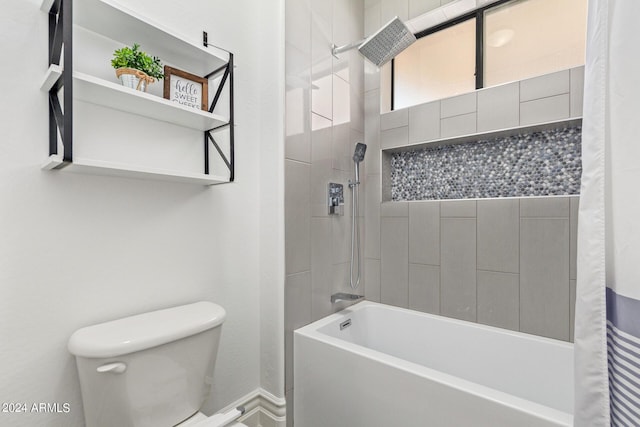 bathroom with shower / tub combo with curtain and toilet