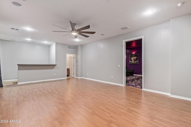 unfurnished room with ceiling fan and light hardwood / wood-style flooring