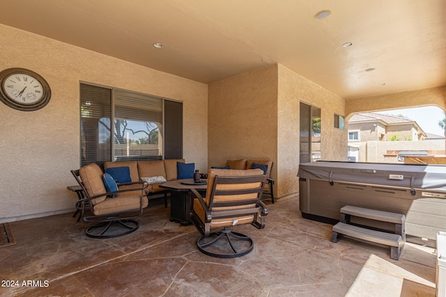 view of patio featuring outdoor lounge area and a hot tub