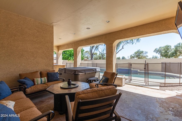 view of patio / terrace featuring a pool with hot tub