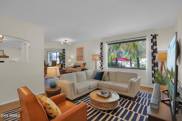 living room with plenty of natural light and baseboards