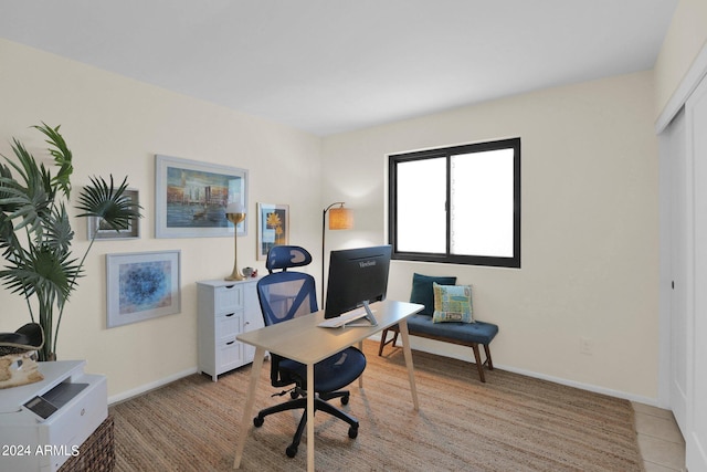 office space featuring light tile patterned flooring and baseboards