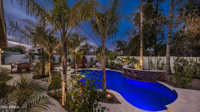 view of swimming pool with a fenced in pool, a fenced backyard, and a patio