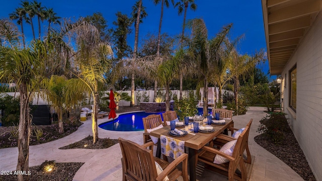 view of pool featuring outdoor dining area, a patio area, a fenced backyard, and a fenced in pool