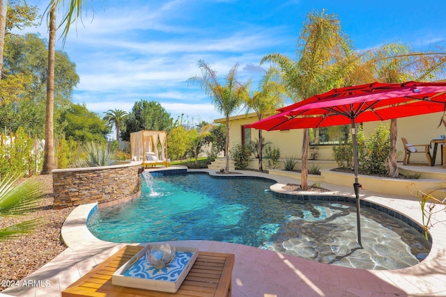 outdoor pool with a patio area