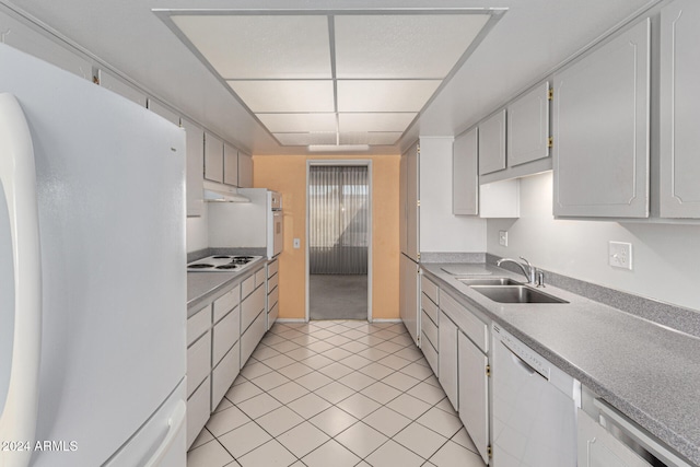 kitchen featuring sink, white cabinets, white appliances, and light tile patterned floors