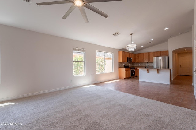 41767 W Somerset Dr, Maricopa, AZ 85138 - unfurnished living room with lofted ceiling, carpet floors, ceiling fan, and recessed lighting