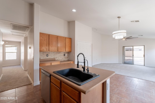 41767 W Somerset Dr, Maricopa, AZ 85138 - kitchen featuring dishwasher, light colored carpet, a ceiling fan, open floor plan, and lofted ceiling