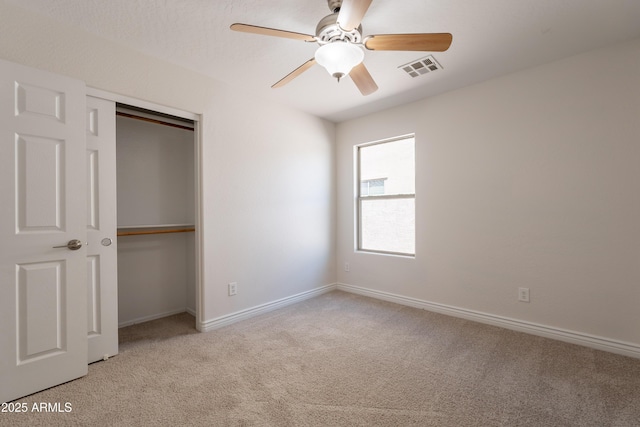 41767 W Somerset Dr, Maricopa, AZ 85138 - unfurnished bedroom featuring light colored carpet, a closet, and ceiling fan