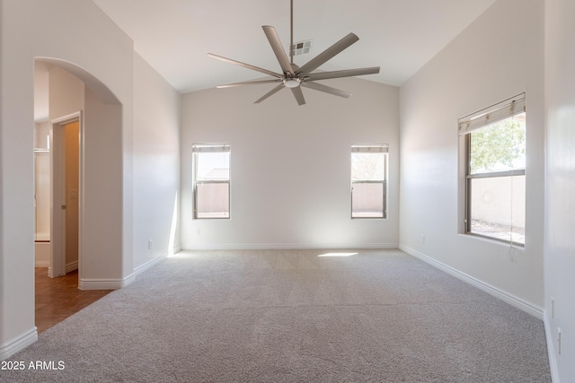 41767 W Somerset Dr, Maricopa, AZ 85138 - carpeted empty room with ceiling fan, arched walkways, and high vaulted ceiling