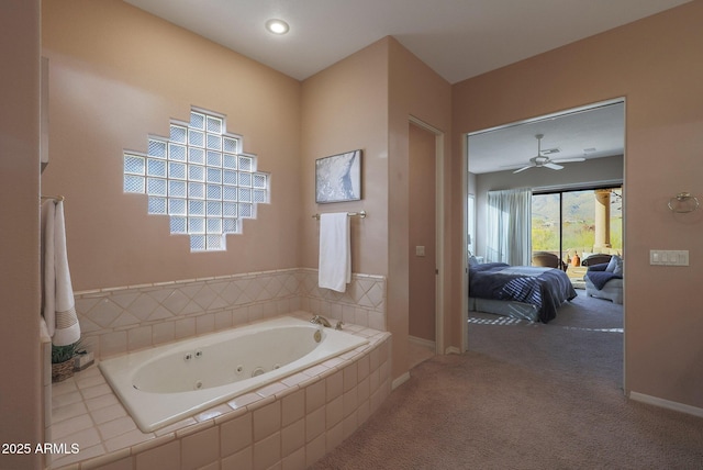 bathroom featuring a jetted tub, baseboards, and connected bathroom