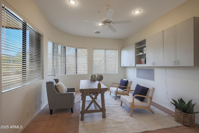 office featuring recessed lighting, light colored carpet, a ceiling fan, visible vents, and baseboards