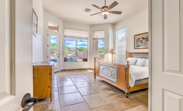 bedroom featuring ceiling fan and access to exterior