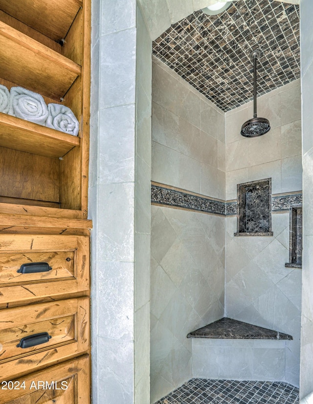 bathroom with tiled shower