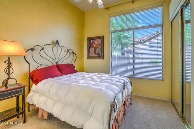 carpeted bedroom with a closet