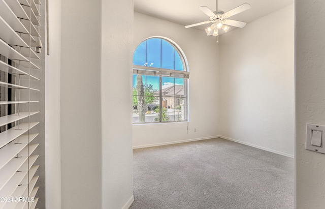 carpeted empty room with ceiling fan