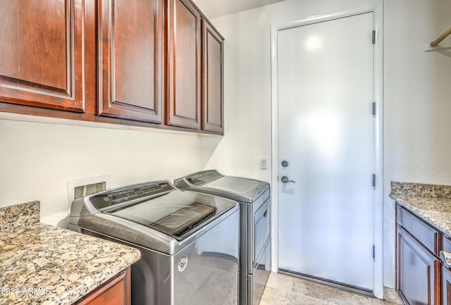 laundry area with cabinets and washer and dryer