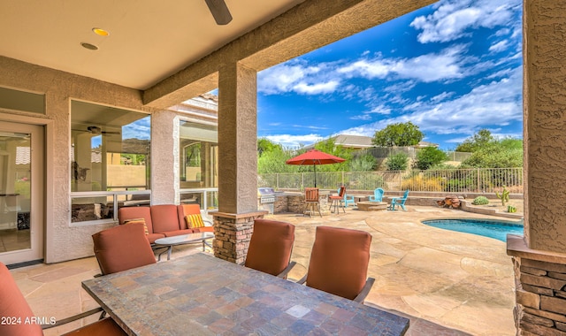 view of patio / terrace featuring ceiling fan, an outdoor hangout area, and a fenced in pool