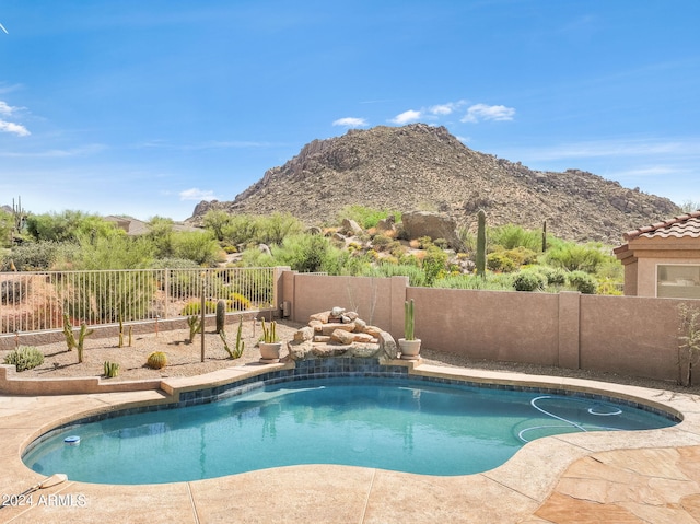 view of swimming pool featuring a mountain view