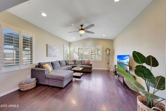 living room with dark hardwood / wood-style flooring, vaulted ceiling, and ceiling fan