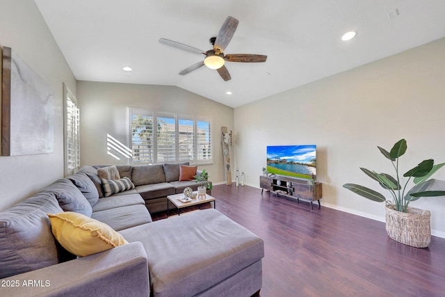 living room with ceiling fan, dark hardwood / wood-style flooring, and vaulted ceiling