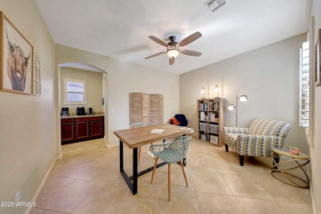 tiled home office with ceiling fan