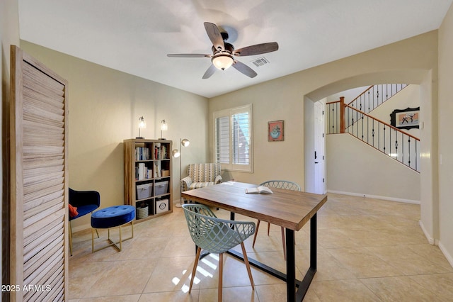 office featuring light tile patterned floors and ceiling fan