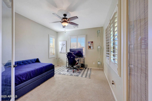 bedroom with ceiling fan and carpet